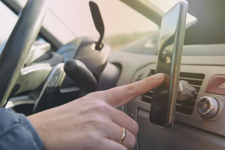 Woman Using Smort Phone While Driving the Car Giroux Pappas Trial Attorneys