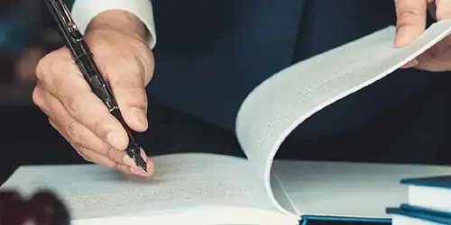 appeal lawyer writing with an ink pen