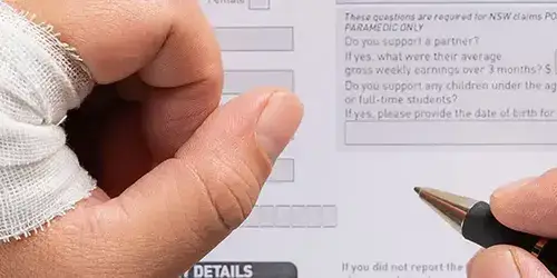 Injured worker filling out a form