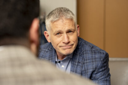 Christian Collis meeting with a client