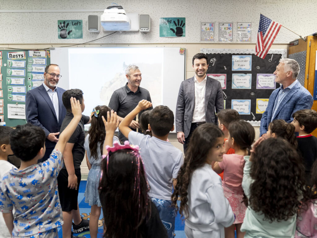 Bob Giroux, Mr. Keramaris, Evan Pappas and Chris Collis answer questions from the class at Haigh Elementary in Dearborn, Michigan.